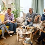 Friends at a Book Club discussing a book together and laughing