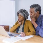 Senior African American Couple Doing Home Finances on Computer